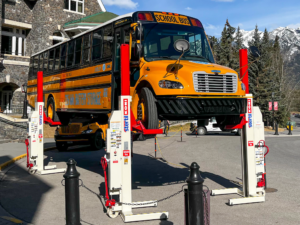 Stertil-Koni Mobile Columns lifting a school bus