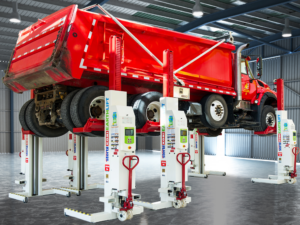 Stertil-Koni EARTHLIFT Mobile Columns lifting a red dump truck